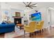 Inviting living room with a cozy fireplace, hardwood floors, and stylish decor at 530 Amalie Farms Dr, Charleston, SC 29492