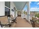 Inviting porch features comfortable seating, stylish decor, and serene outdoor ambiance at 530 Amalie Farms Dr, Charleston, SC 29492
