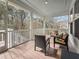 Enjoy this screened porch with comfortable seating and a peaceful outdoor view at 530 Amalie Farms Dr, Charleston, SC 29492