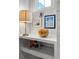Nicely decorated shelf space with lamp and various pieces of colorful art at 530 Amalie Farms Dr, Charleston, SC 29492