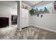 Spacious walk-in closet featuring neutral carpet, storage shelving and a window at 530 Amalie Farms Dr, Charleston, SC 29492