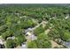 Aerial view of a neighborhood with lush trees and charming homes, showcasing a pool at 5806 Beverly Dr, Hanahan, SC 29410