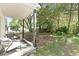 Cozy back porch with outdoor seating, perfect for relaxing in the serene backyard setting at 5806 Beverly Dr, Hanahan, SC 29410