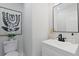 Clean bathroom with modern black and white accents, vanity, and a toilet at 5806 Beverly Dr, Hanahan, SC 29410