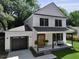 Stunning two-story home with a charming front porch and a well-manicured lawn at 5806 Beverly Dr, Hanahan, SC 29410
