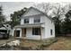 Charming two-story home featuring white siding, a welcoming front porch, and classic architectural details at 5806 Beverly Dr, Hanahan, SC 29410