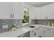 Kitchen featuring stainless steel appliances, bright countertops, and a view to outside at 5806 Beverly Dr, Hanahan, SC 29410