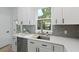 Well-designed kitchen area with stainless steel appliances, countertops, and a view to outside at 5806 Beverly Dr, Hanahan, SC 29410