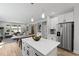 Spacious kitchen featuring an island, stainless steel appliances, and an open layout to the living space at 5806 Beverly Dr, Hanahan, SC 29410
