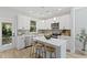 Contemporary kitchen with white cabinets, an island with seating, and stainless steel appliances at 5806 Beverly Dr, Hanahan, SC 29410