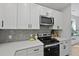 Bright kitchen with stainless steel appliances and a sleek, contemporary design at 5806 Beverly Dr, Hanahan, SC 29410