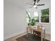 Bright office space with large windows, a ceiling fan, and a neutral color palette at 5806 Beverly Dr, Hanahan, SC 29410