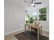 Bright office space with large windows, a ceiling fan, and a neutral color palette at 5806 Beverly Dr, Hanahan, SC 29410