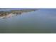 Stunning aerial view of a lake coastline with scattered homes and docks under a clear sky at 634 Lakeside Dr, Moncks Corner, SC 29461