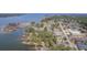 Overhead neighborhood shot with multiple lakeside properties, boat storage, and ample trees at 634 Lakeside Dr, Moncks Corner, SC 29461