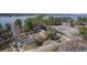 Aerial view of waterfront neighborhood showcasing homes with lake access and a private parking area nearby at 634 Lakeside Dr, Moncks Corner, SC 29461