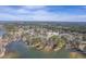 Expansive aerial view of a lake community surrounded by dense trees, highlighting a serene lakeside environment at 634 Lakeside Dr, Moncks Corner, SC 29461