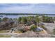 Aerial view of waterfront properties showing the homes, boat docks and the community's access to the lake at 634 Lakeside Dr, Moncks Corner, SC 29461