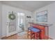 Cozy bar area with stools and access to outside at 634 Lakeside Dr, Moncks Corner, SC 29461