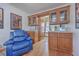 The bar area features cabinets, a countertop, sink and a comfortable blue easy chair at 634 Lakeside Dr, Moncks Corner, SC 29461
