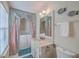 Bathroom showcasing a vanity, mirror, and walk-in tub with curtains at 634 Lakeside Dr, Moncks Corner, SC 29461