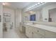 The bathroom features a white tile floor and walls, and ample counter space at 634 Lakeside Dr, Moncks Corner, SC 29461