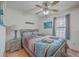 Comfortable bedroom with ceiling fan, wood flooring, and nautical-themed bedding at 634 Lakeside Dr, Moncks Corner, SC 29461