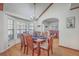 Charming dining room with lots of natural light and seating for six at 634 Lakeside Dr, Moncks Corner, SC 29461
