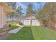 Detached two car garage with a view of the lake in the background at 634 Lakeside Dr, Moncks Corner, SC 29461