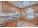 Cozy kitchen with wood cabinets, window seat, and ample counter space at 634 Lakeside Dr, Moncks Corner, SC 29461