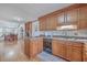 Open kitchen featuring wood cabinets, dishwasher, and wood floors at 634 Lakeside Dr, Moncks Corner, SC 29461