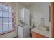 The laundry room features a stacked washer and dryer, and a white sink at 634 Lakeside Dr, Moncks Corner, SC 29461