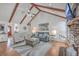 Bright living room with vaulted ceilings, exposed beams, and a cozy seating area at 634 Lakeside Dr, Moncks Corner, SC 29461