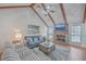 Inviting living room features vaulted ceilings, a brick fireplace, and comfortable seating at 634 Lakeside Dr, Moncks Corner, SC 29461