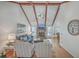 Comfortable living room with brick fireplace, hardwood floors, and high ceilings at 634 Lakeside Dr, Moncks Corner, SC 29461