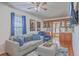 Comfortable living room features a plush couch, an ottoman, and built-in bar area at 634 Lakeside Dr, Moncks Corner, SC 29461