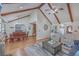 Open-concept living and dining area with wood floors, vaulted ceilings, and modern furnishings at 634 Lakeside Dr, Moncks Corner, SC 29461