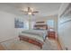 Well-lit bedroom features a plush rug, ceiling fan, and a king-size bed at 634 Lakeside Dr, Moncks Corner, SC 29461