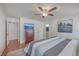 Open and airy bedroom featuring a ceiling fan, a king bed and hardwood flooring at 634 Lakeside Dr, Moncks Corner, SC 29461