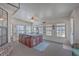 The sun room includes a jacuzzi, a brick accent wall, and many windows at 634 Lakeside Dr, Moncks Corner, SC 29461