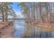 Picturesque waterfront with tree lined views of the water creating a serene and natural setting at 634 Lakeside Dr, Moncks Corner, SC 29461