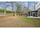A spacious backyard with a playground and a screened in back porch at 8153 Governors Walk, North Charleston, SC 29418