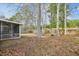 View of the back yard showing the play area and screened in back porch at 8153 Governors Walk, North Charleston, SC 29418