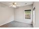 Bedroom with neutral walls, carpet, ceiling fan, and a bright window at 8153 Governors Walk, North Charleston, SC 29418