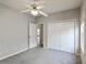 Bedroom with neutral walls, carpet, closet, and a ceiling fan at 8153 Governors Walk, North Charleston, SC 29418