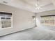 Spacious bedroom with a trey ceiling, ceiling fan, plush carpet and large windows at 8153 Governors Walk, North Charleston, SC 29418