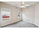 Bedroom with neutral walls, carpet, windows with blinds, and a neighborhood view at 8153 Governors Walk, North Charleston, SC 29418
