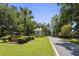 Charming community entrance featuring a gazebo, lush landscaping, and mature trees on a sunny day at 8153 Governors Walk, North Charleston, SC 29418