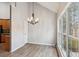 Bright dining room featuring a modern chandelier and a big window at 8153 Governors Walk, North Charleston, SC 29418