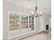 Dining room with a modern chandelier and view of the outdoor playground at 8153 Governors Walk, North Charleston, SC 29418